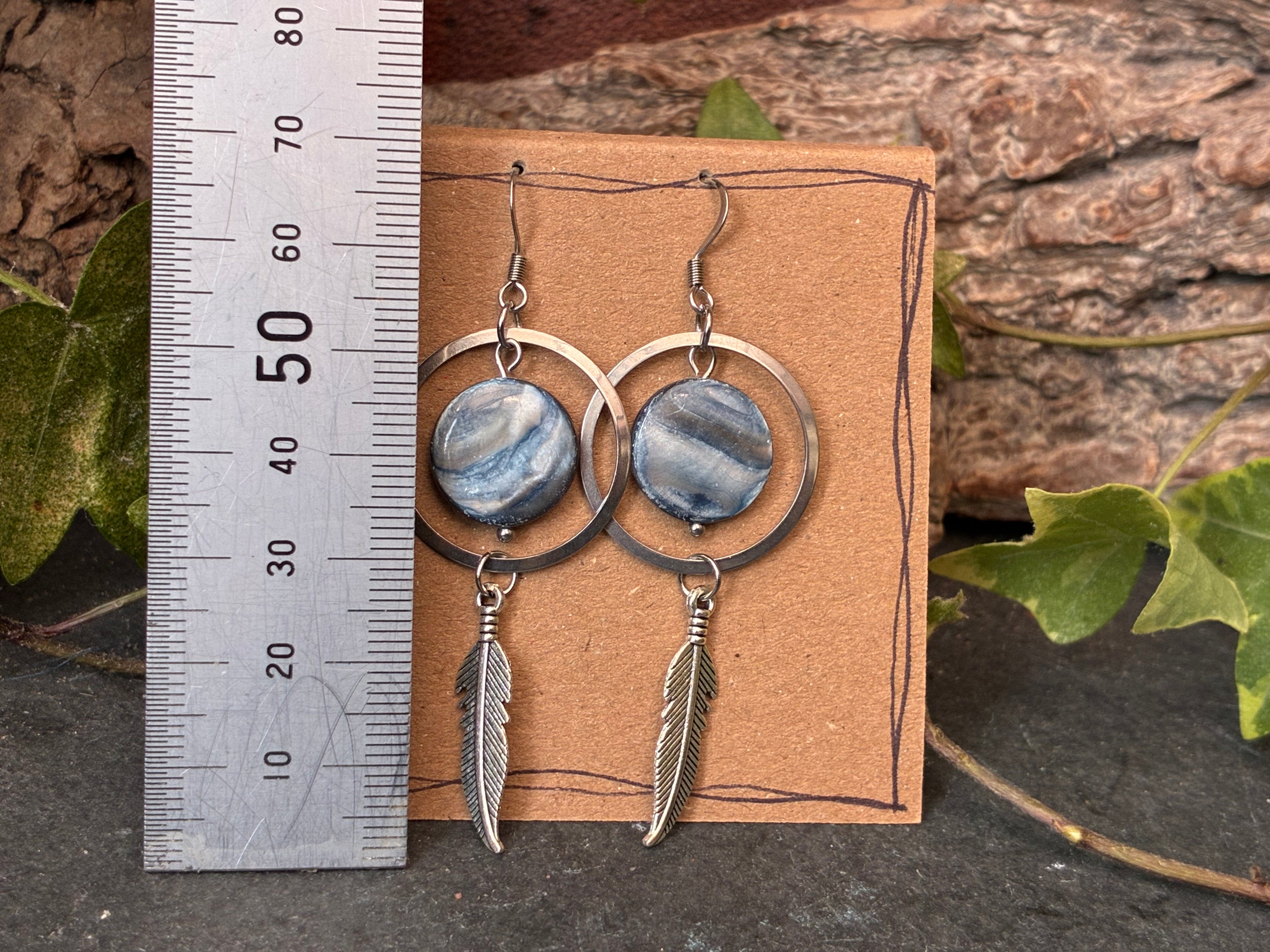 Blue beaded feather earrings