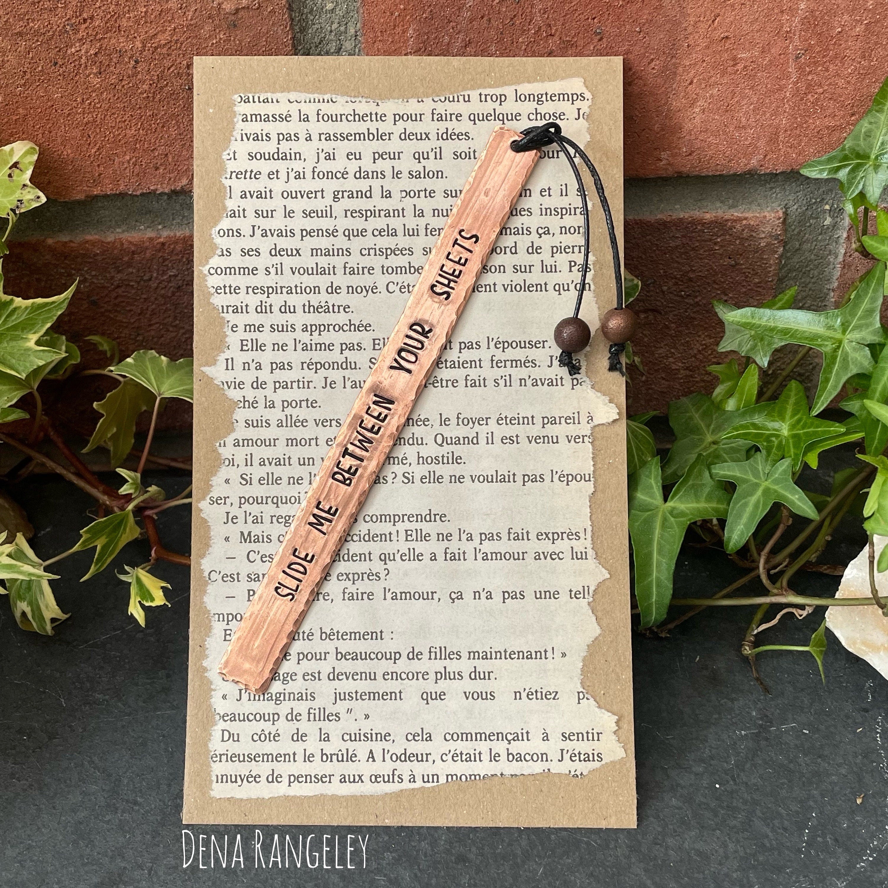 Copper bookmarks. Stamped bookmark. Fell asleep here. Between the sheets. A book is a dream. Just one more chapter.