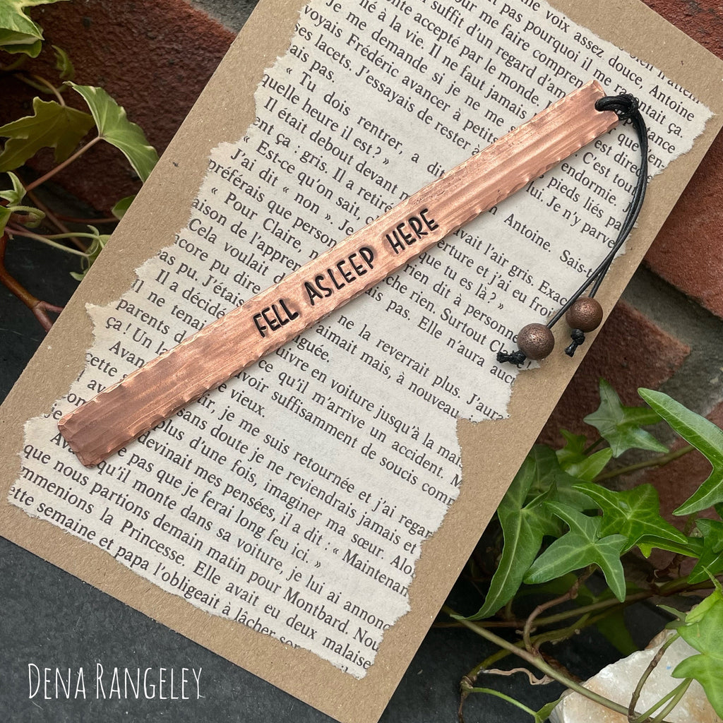 Copper bookmarks. Stamped bookmark. Fell asleep here. Between the sheets. A book is a dream. Just one more chapter.