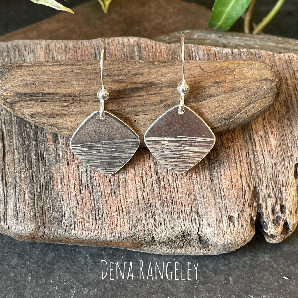 Sterling silver textured earrings.