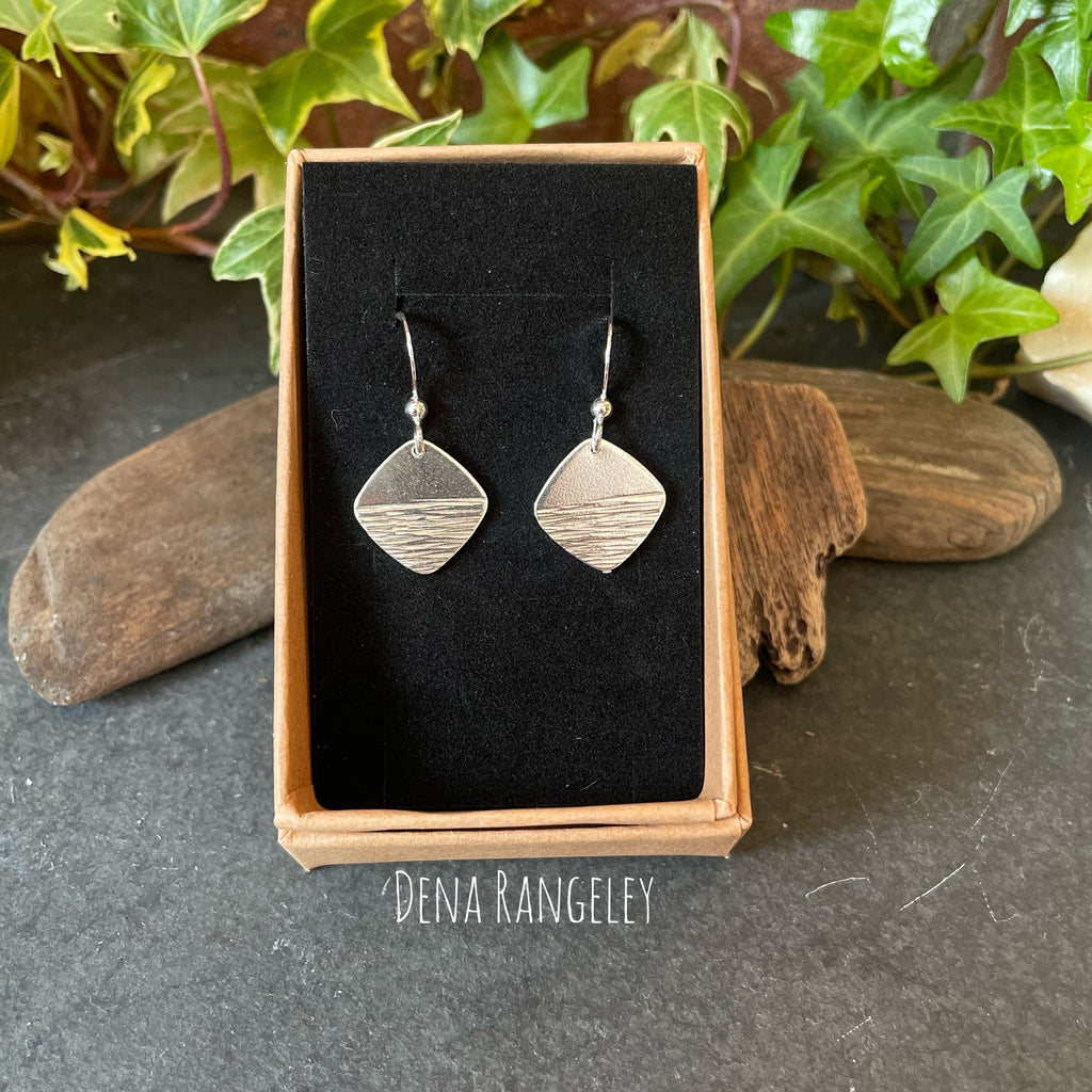 Sterling silver textured earrings.