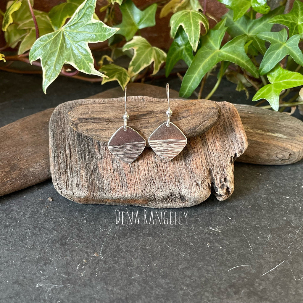 Sterling silver textured earrings.