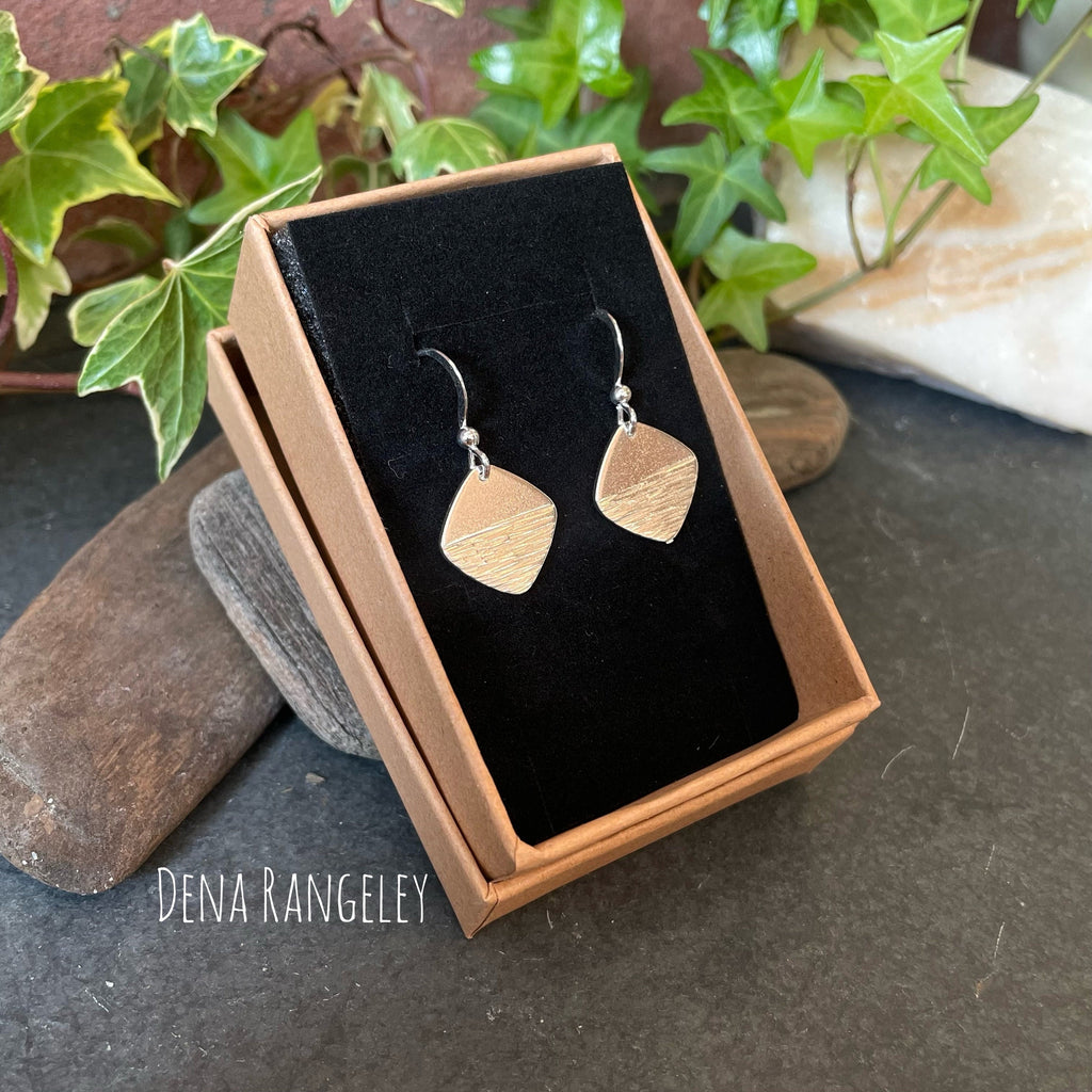 Sterling silver textured earrings.