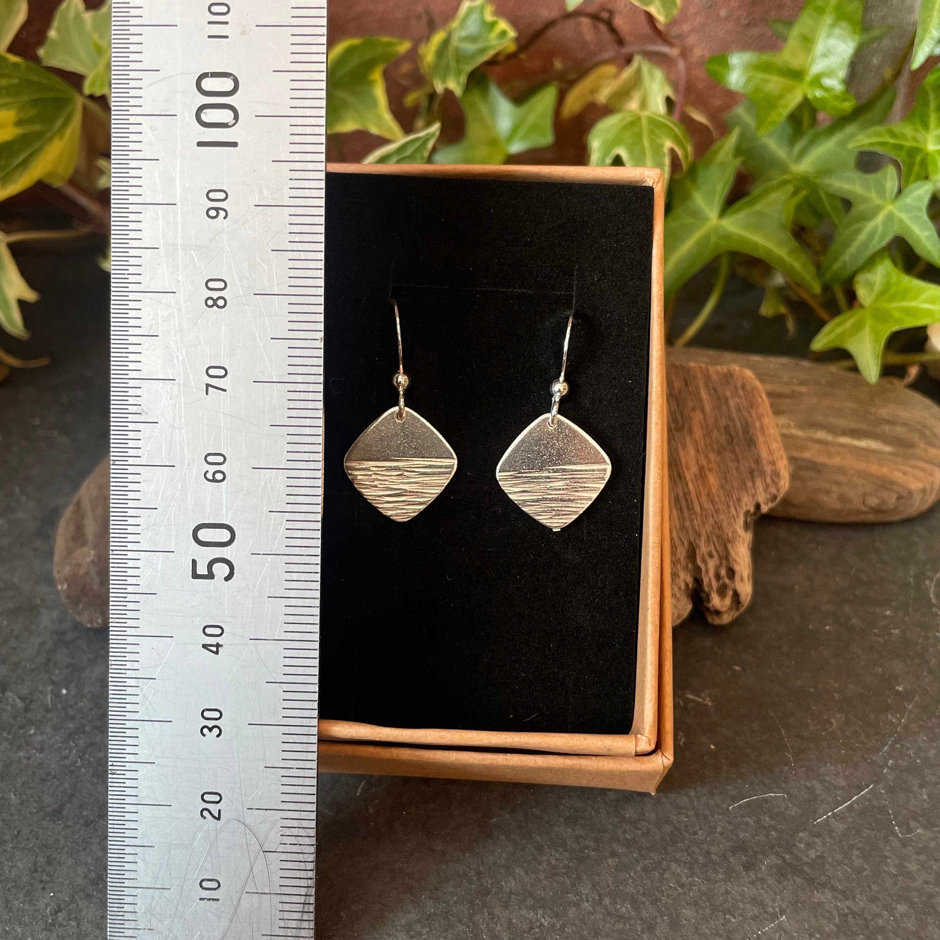 Sterling silver textured earrings.